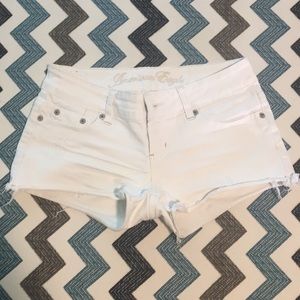 Distressed white shorts